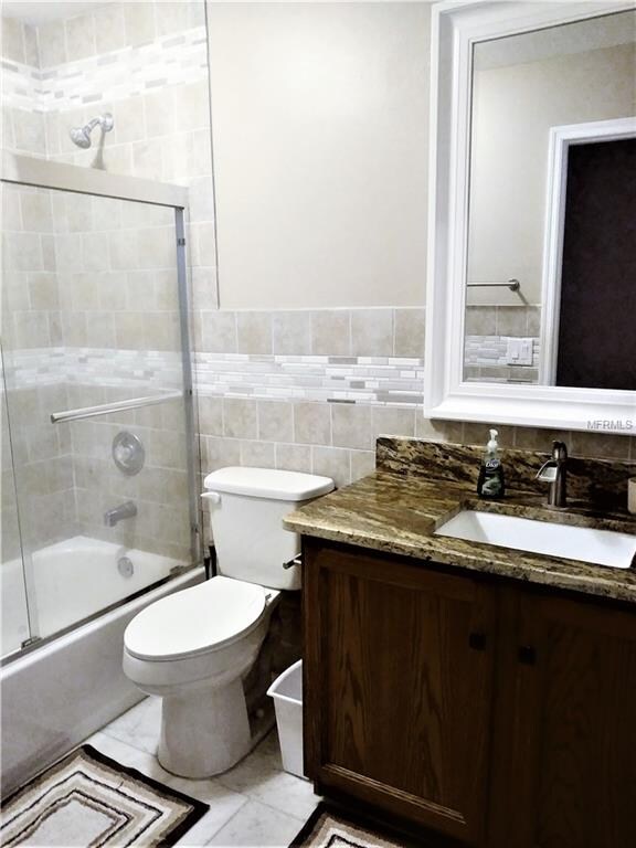 Main Bath has granite counter tops and updated til