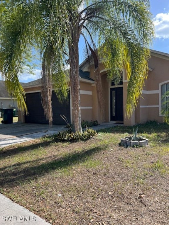 Obstructed view of property featuring stucco sidin