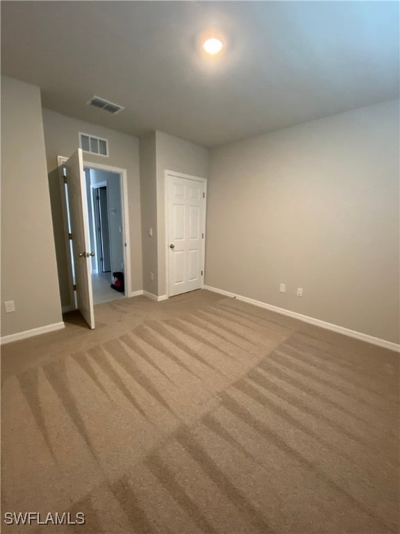 Empty room with carpet flooring
