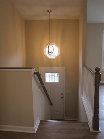 Foyer/entry has a beautiful new light fixture.