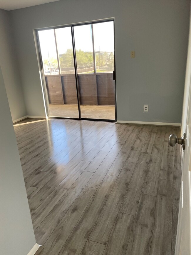 Bedroom with access to screened patio.