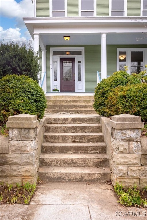 Property entrance with covered porch