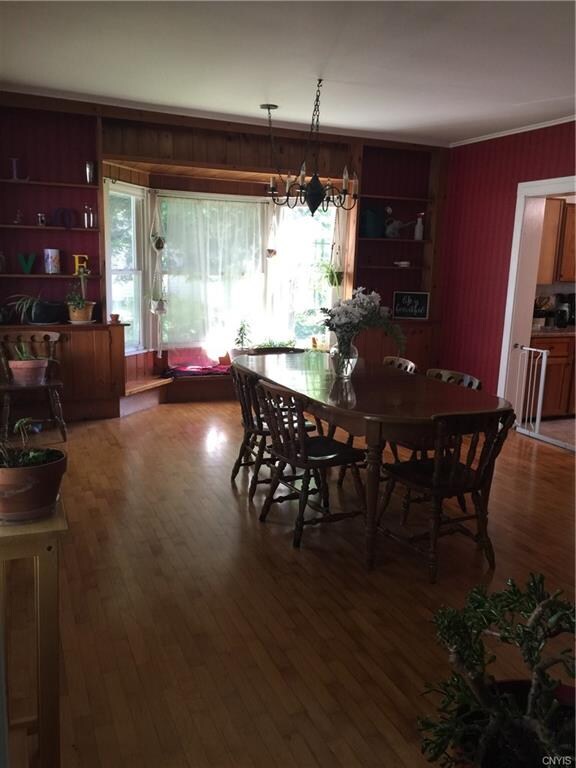 Dining room with built-ins and hardwood floors.