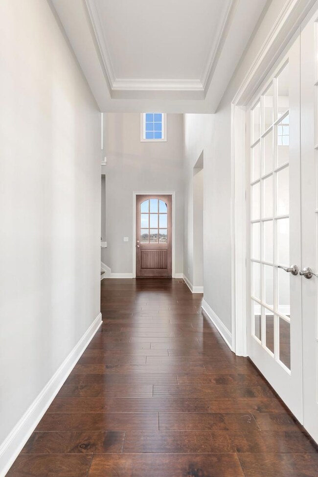 Grand 2 story foyer with beautiful hardwood and trim detail!