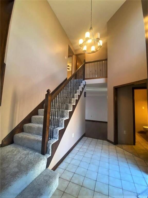 As you walk in, laundry and 1/2 bath are to your right. Hall leads to main floor family room with fireplace. Stairs lead to 3 bedrooms.