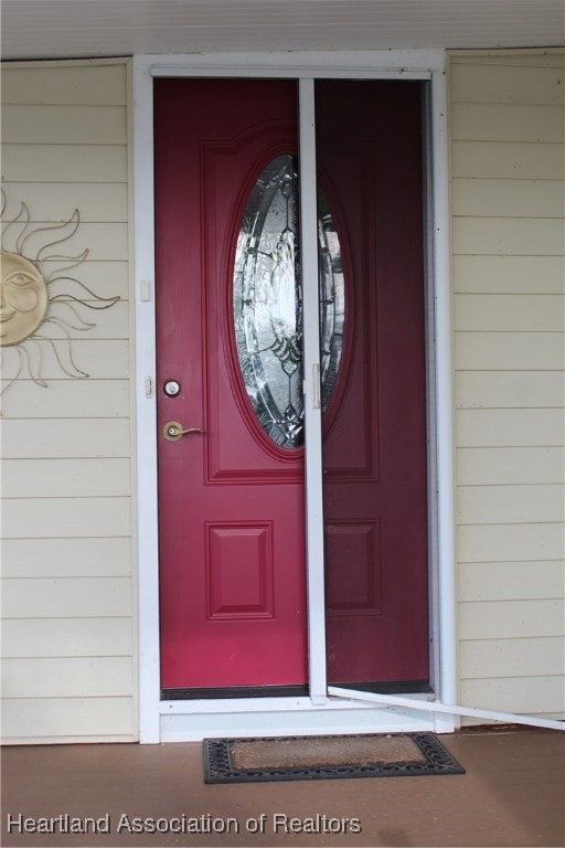 Pocket screen door at covered entrance