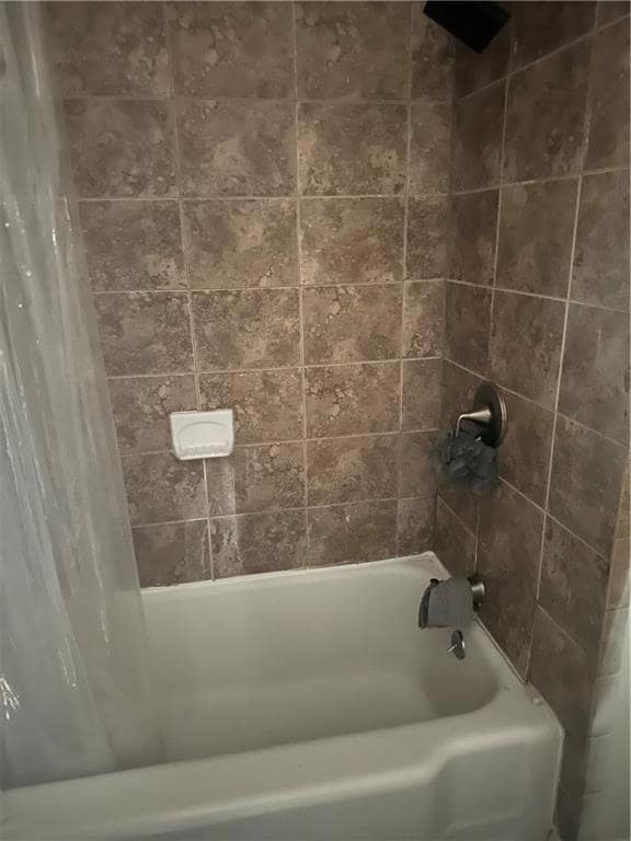 Bathroom with shower / tub combo
