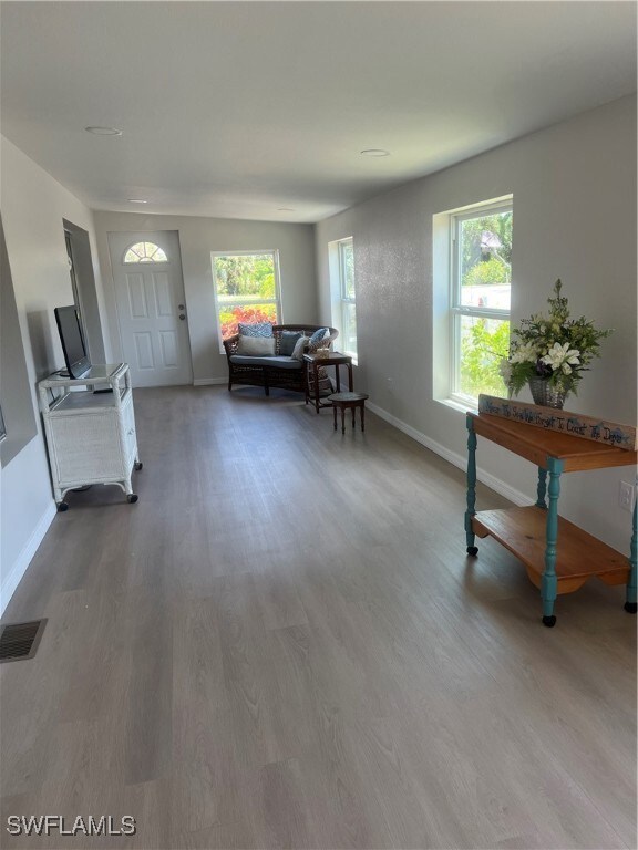 Living area featuring wood finished floors, health