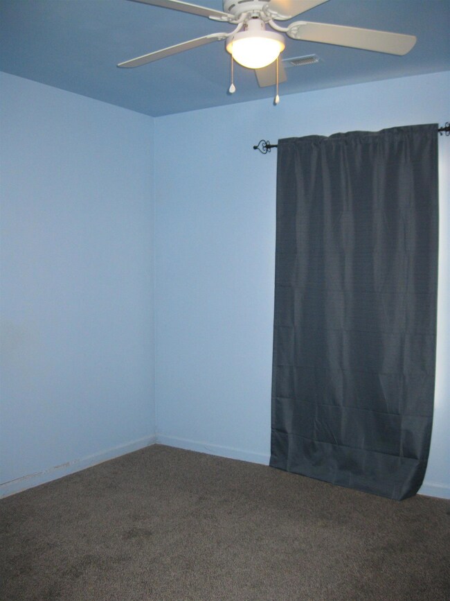 Another of the secondary bedrooms with nice sized closet and newer carpet.