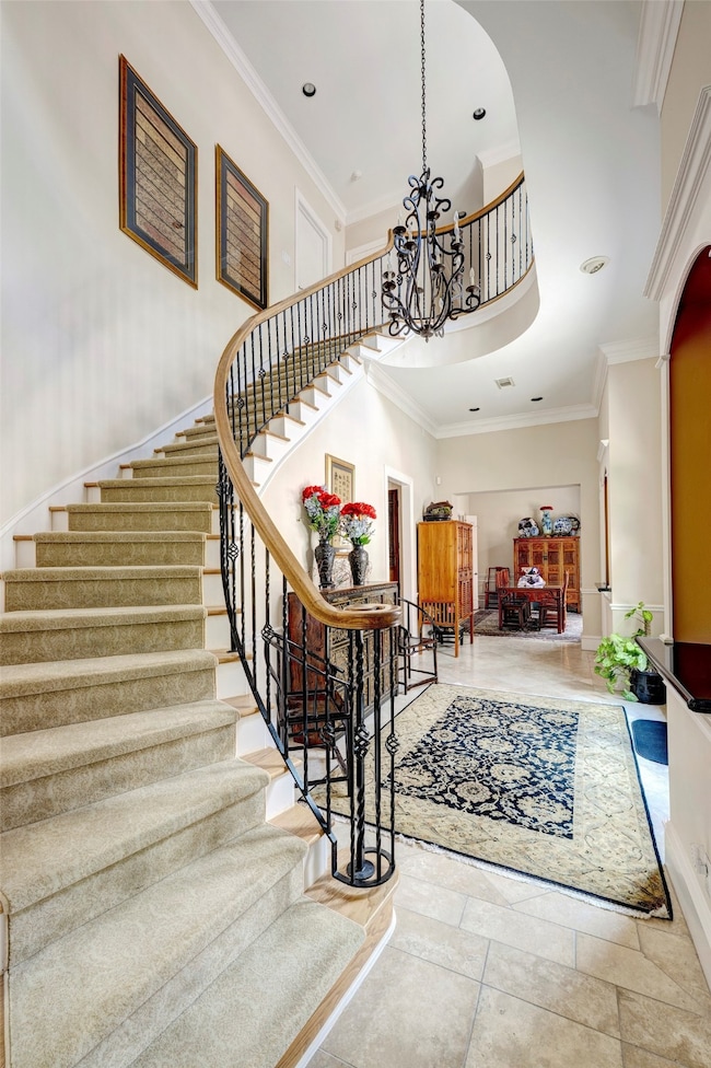 A graceful curved staircase offers a stunning arch