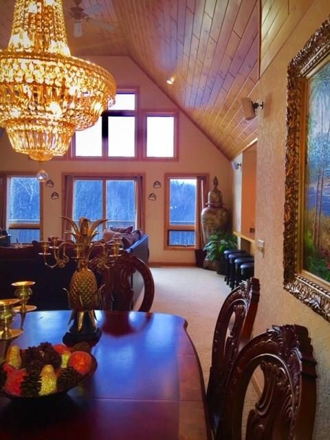 Large vaulted great room includes a stunning wall
