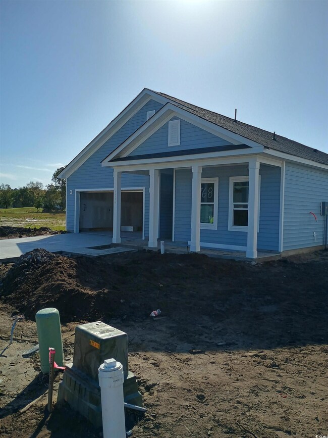 View of front of property featuring a garage and a