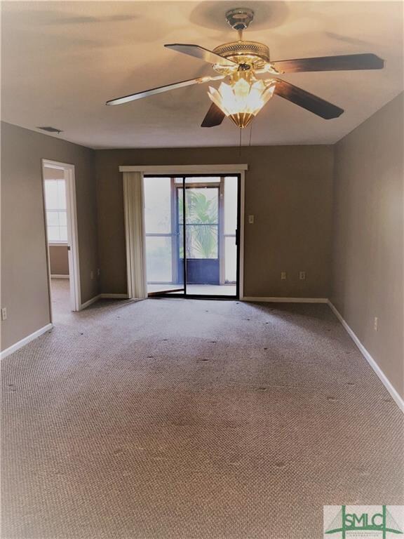 Living and dining area with views to the back cour
