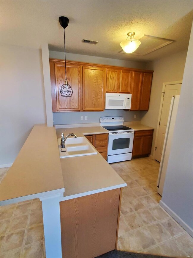 Kitchen with breakfast bar.