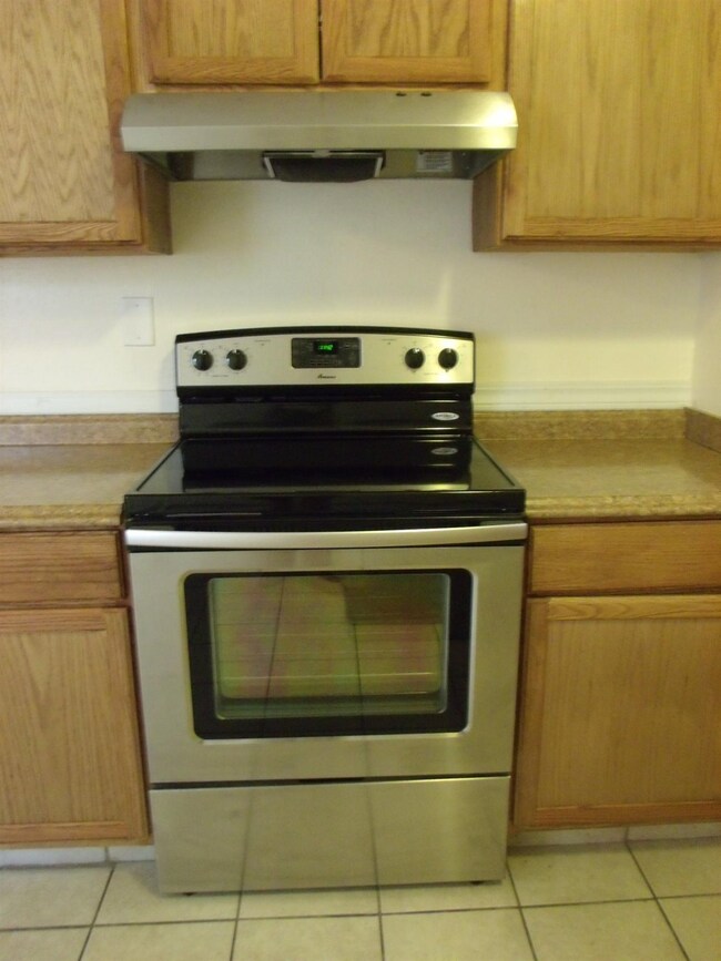 NEW STAINLESS STEEL STOVE.
