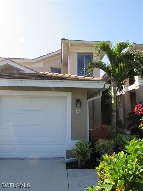 View of front of property featuring a garage