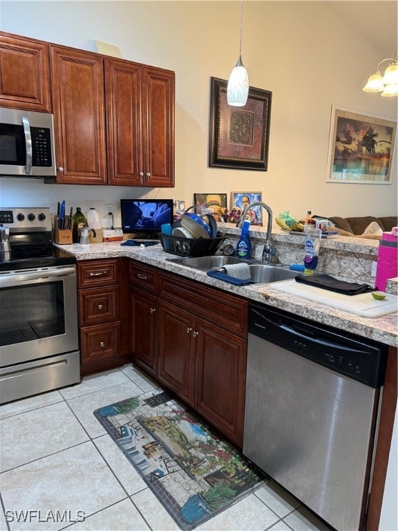 Kitchen with dishwasher, stove, light tile pattern
