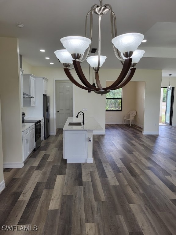Kitchen featuring range with electric cooktop, ref