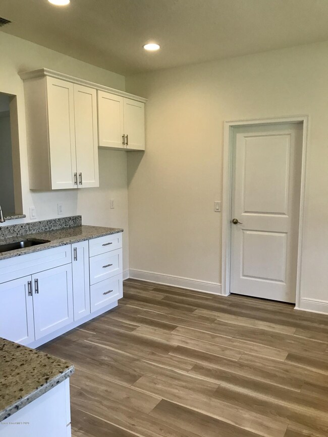 Kitchen leading to Laundry Room