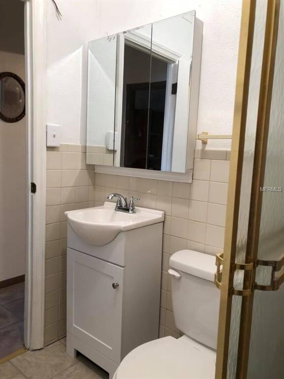 bathroom with new vanity and toilet.