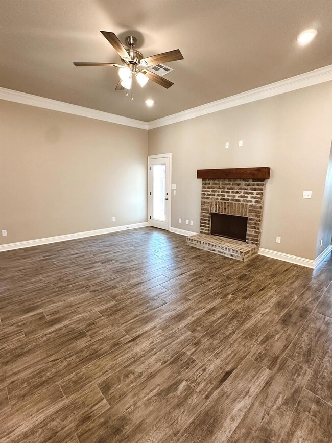Unfurnished living room featuring ornamental moldi