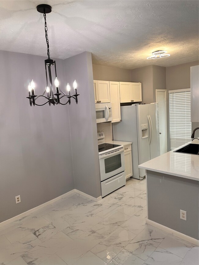 Fresh tiled flooring with update kitchen