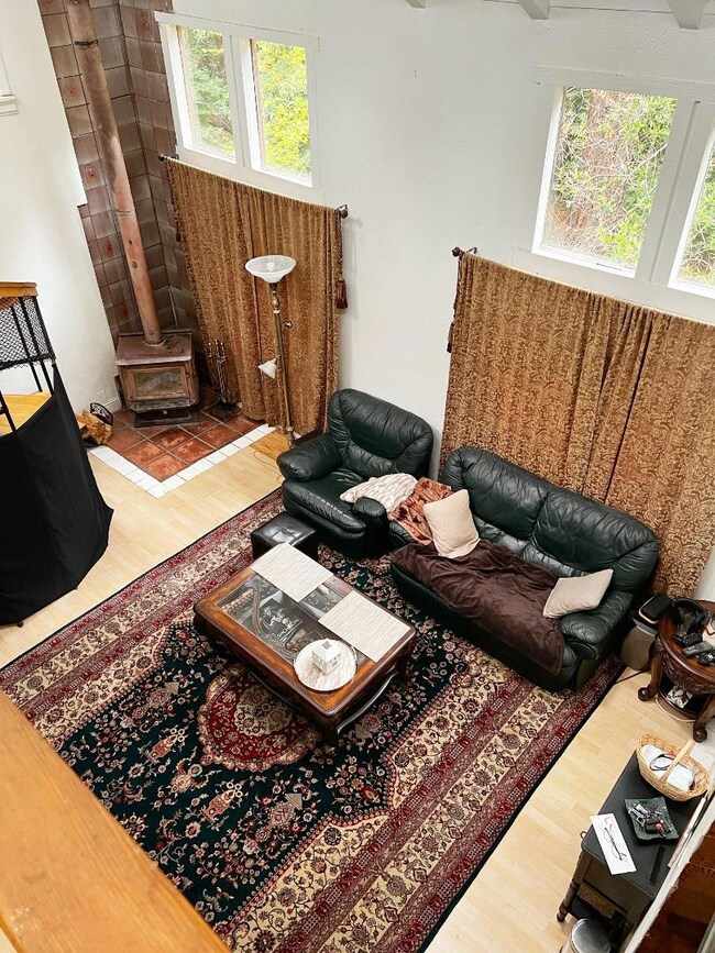 Spacious living room with abundant natural light.