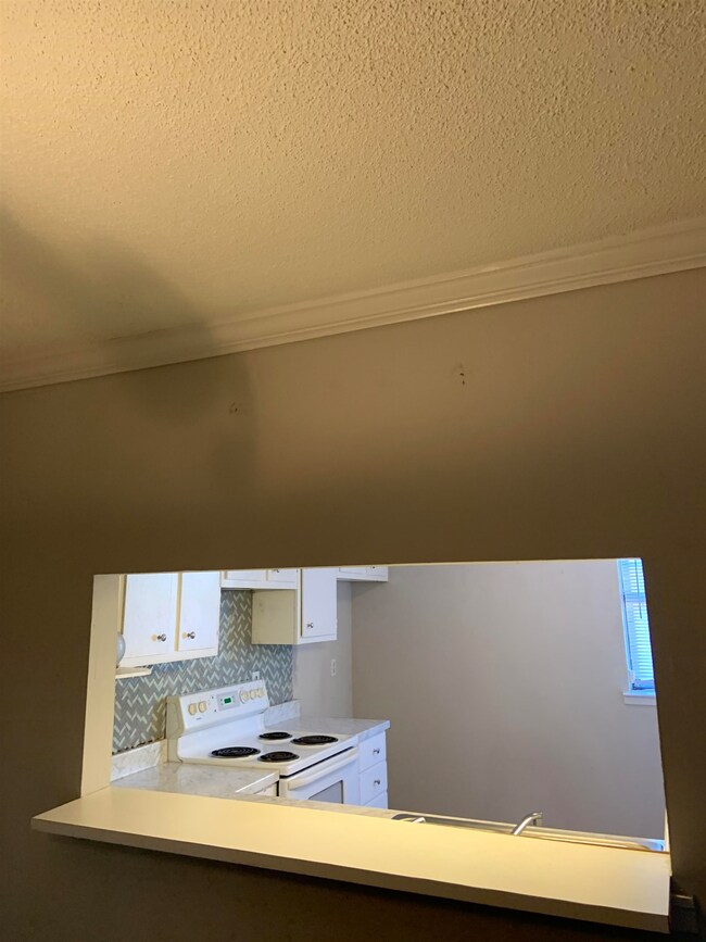 Kitchen featuring white electric range oven, taste