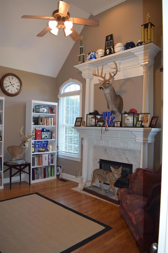 Double tier fireplace and vaulted ceilings in office!