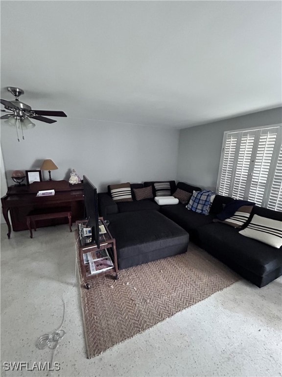 Living room featuring ceiling fan