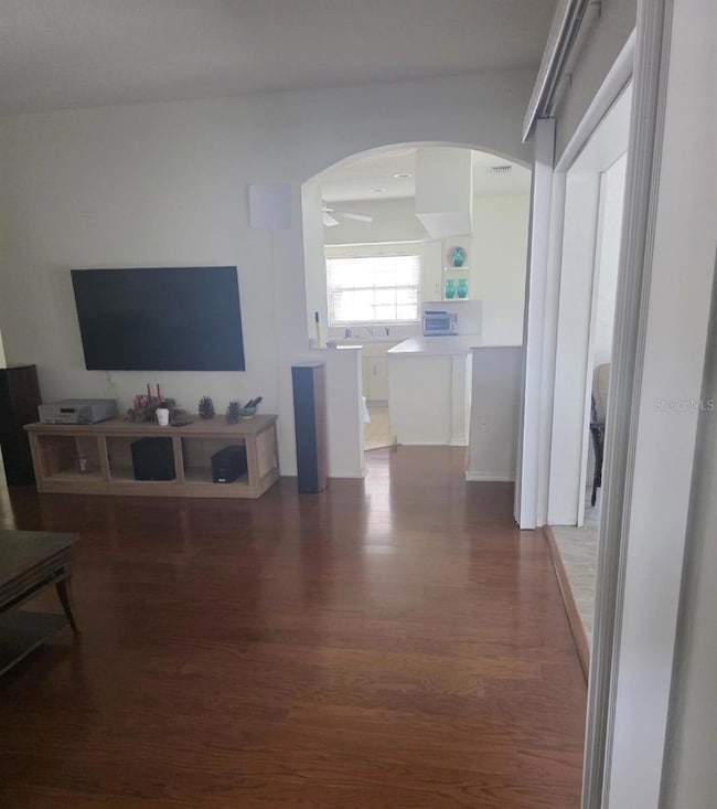 Overlooking the living room through the dining room from the primary