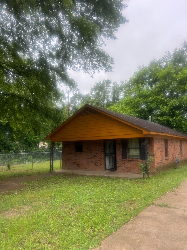 Exterior space featuring a front lawn