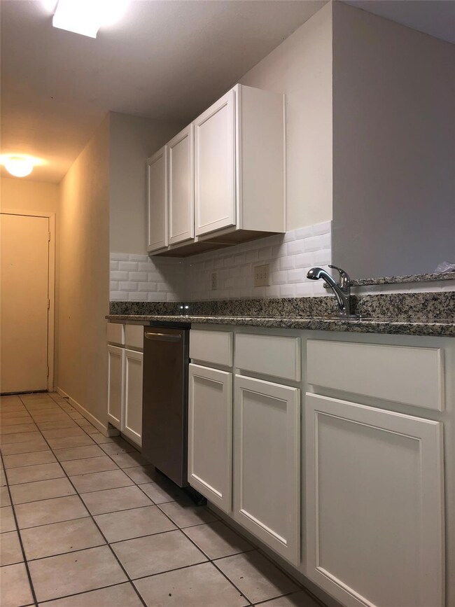 Kitchen featuring light tile patterned floors, st
