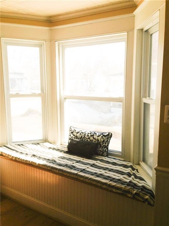 Window seat open to kitchen and...