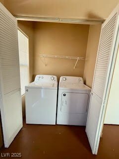 Laundry area featuring separate washer and dryer a
