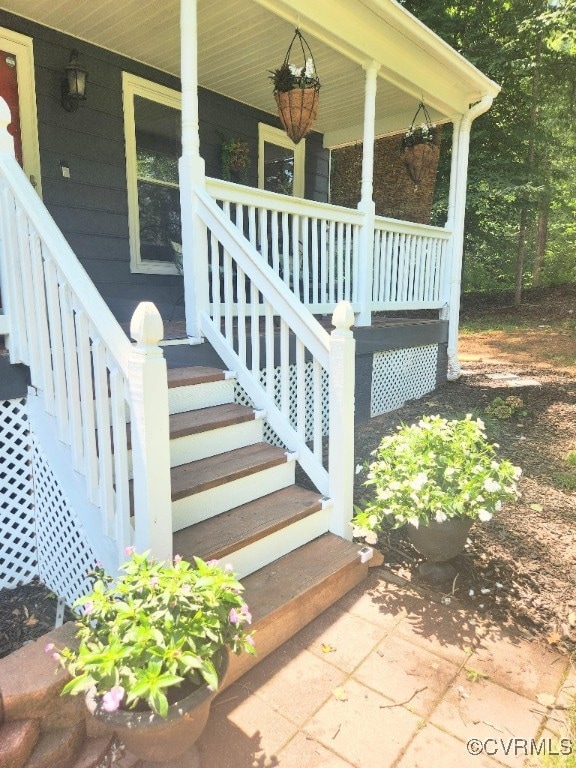 Entrance to property featuring covered porch