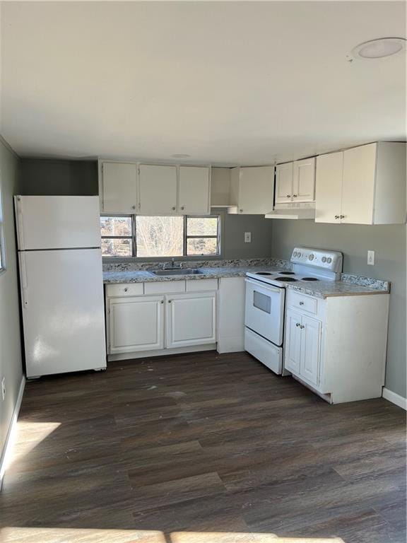 Kitchen with white cabinets, range, range hood, fr
