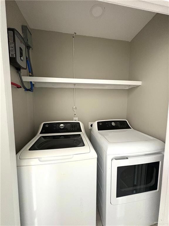 Washroom featuring independent washer and dryer