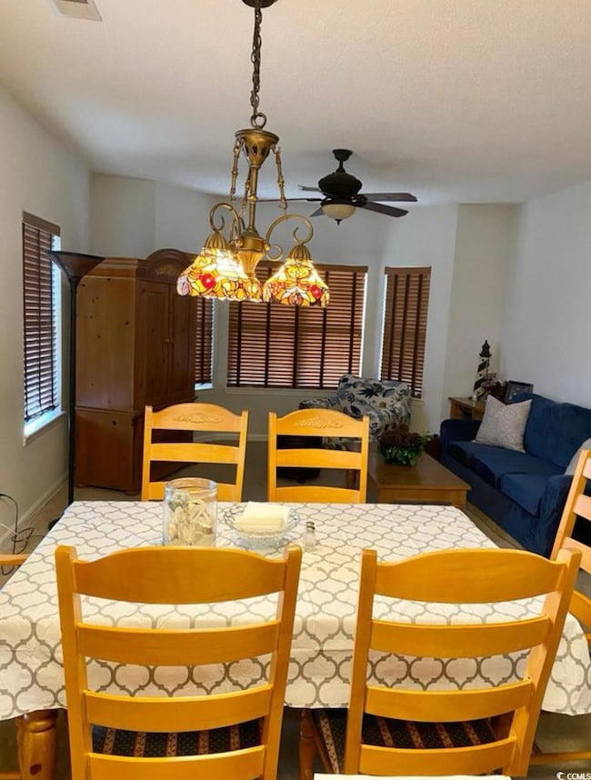 Dining area with a ceiling fan