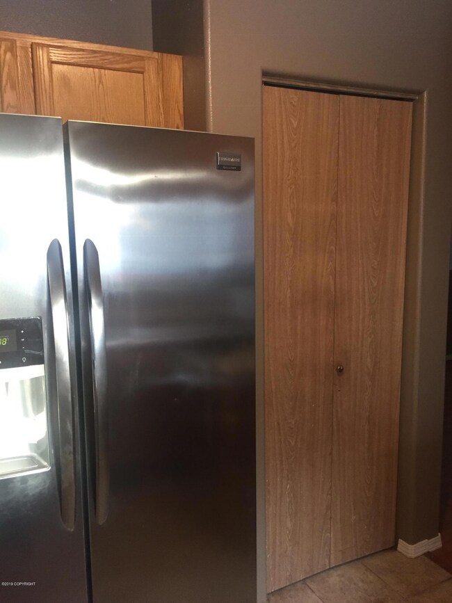 kitchen with ss fridge