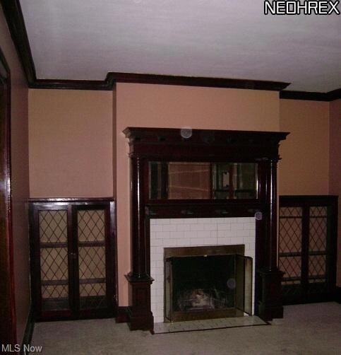 Living room with woodburning fireplace and built-in shelves!