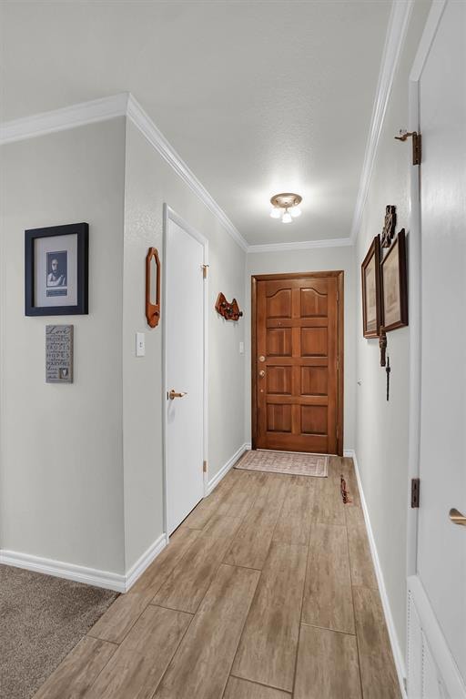 Corridor featuring crown molding and wood tile finished floors