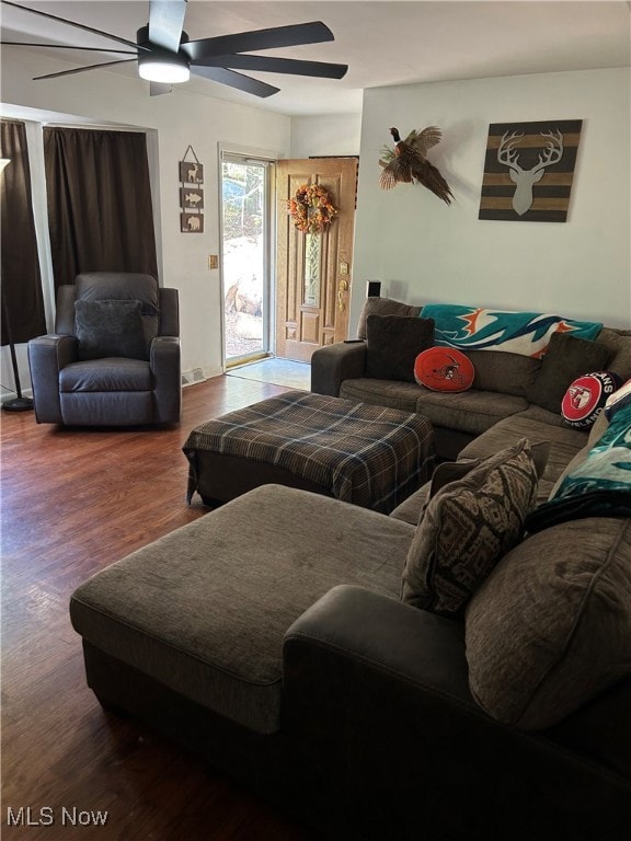 Living room with wood finished floors and ceiling fan