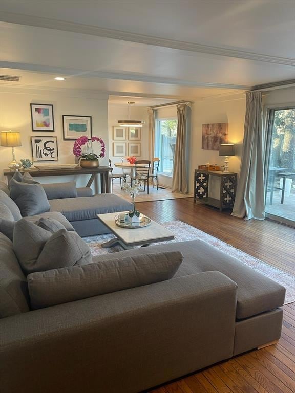 Living room with hardwood / wood-style floors and 