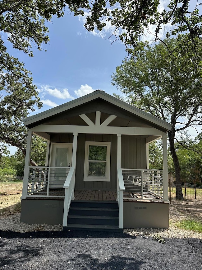 Doorway to property with covered porch