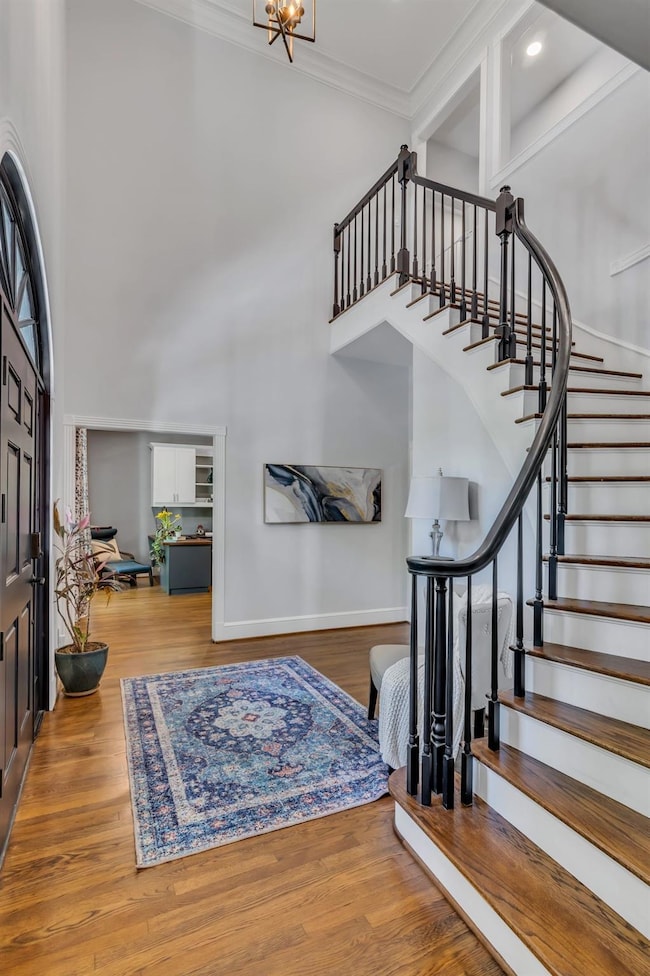 Elegant curved staircase as the showcase of your foyer