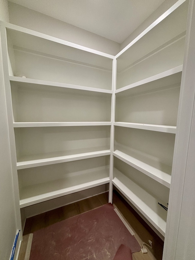 Great walk in pantry provides exceptional storage. All wood shelving throughout!