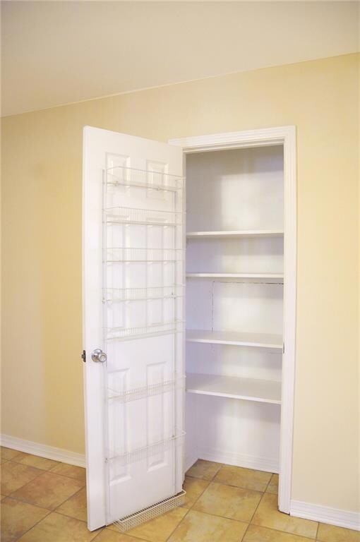 Pantry near kitchen area for your convenience.