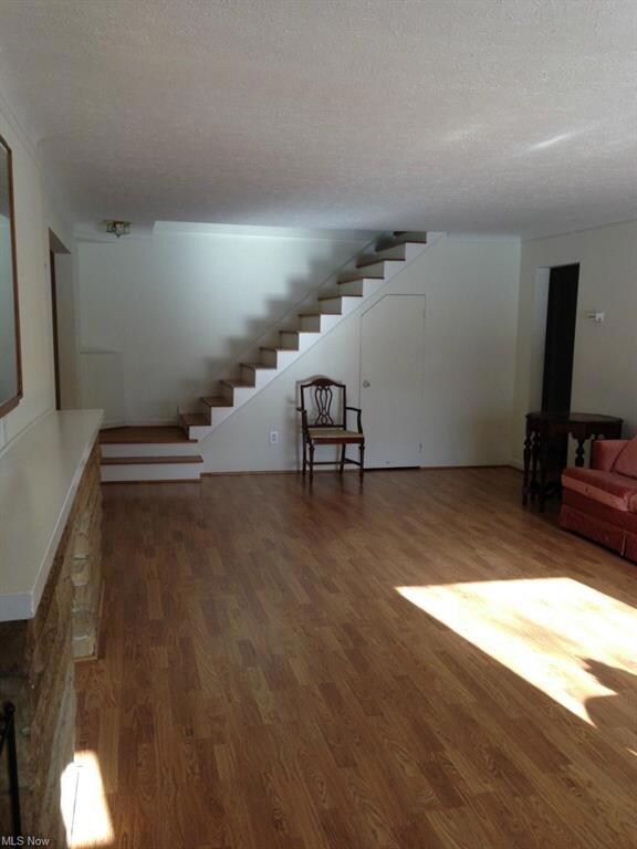 living room with gleaming wood floors
