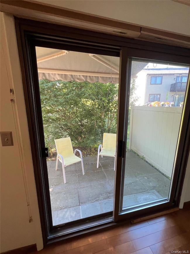 Entryway to patio featuring wood finished floors